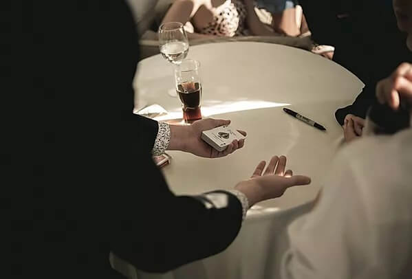 Magician Jack Beck performing at a wedding