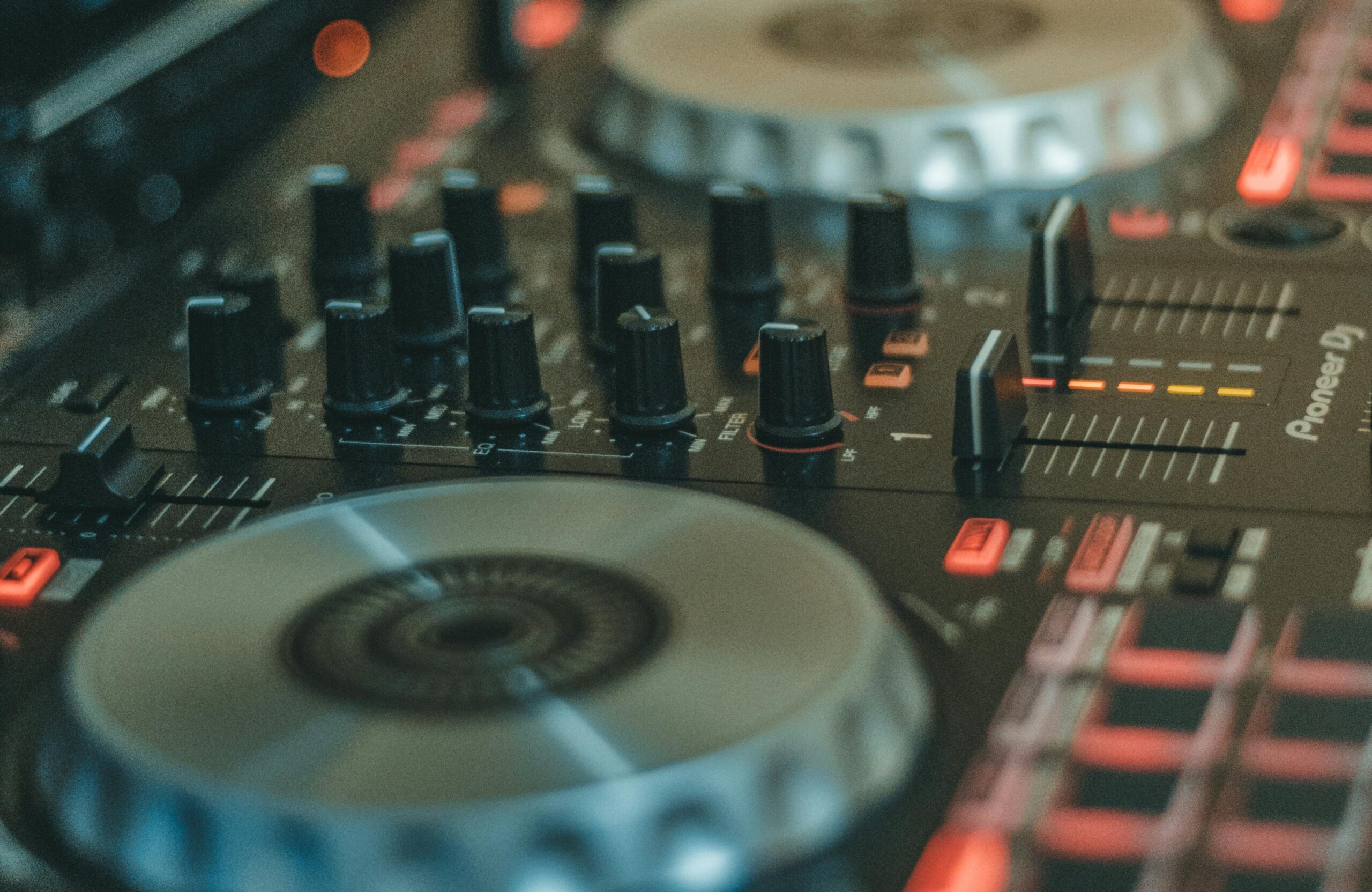 An image of DJ mixing decks